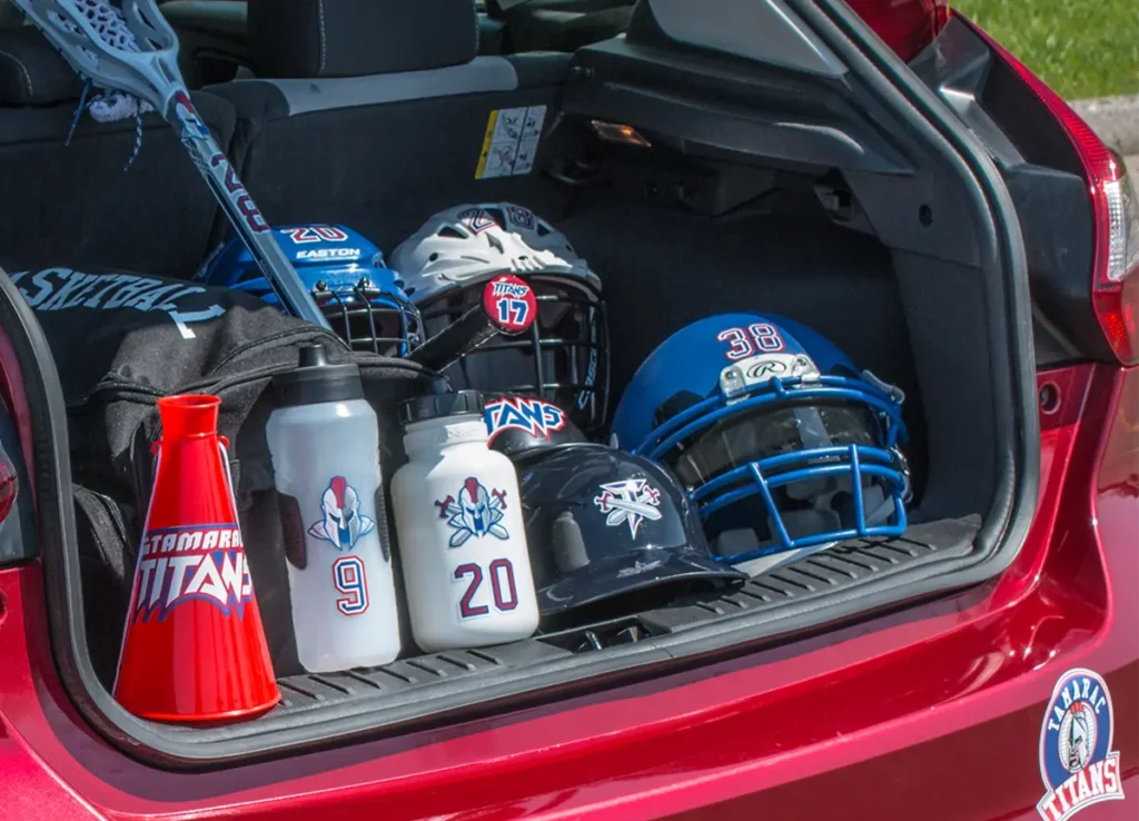 picture of open truck of SUV with decorated sports gear