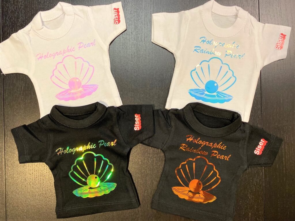 picture of mini tees with Siser Holographic Rainbow Pearl HTV applied to them